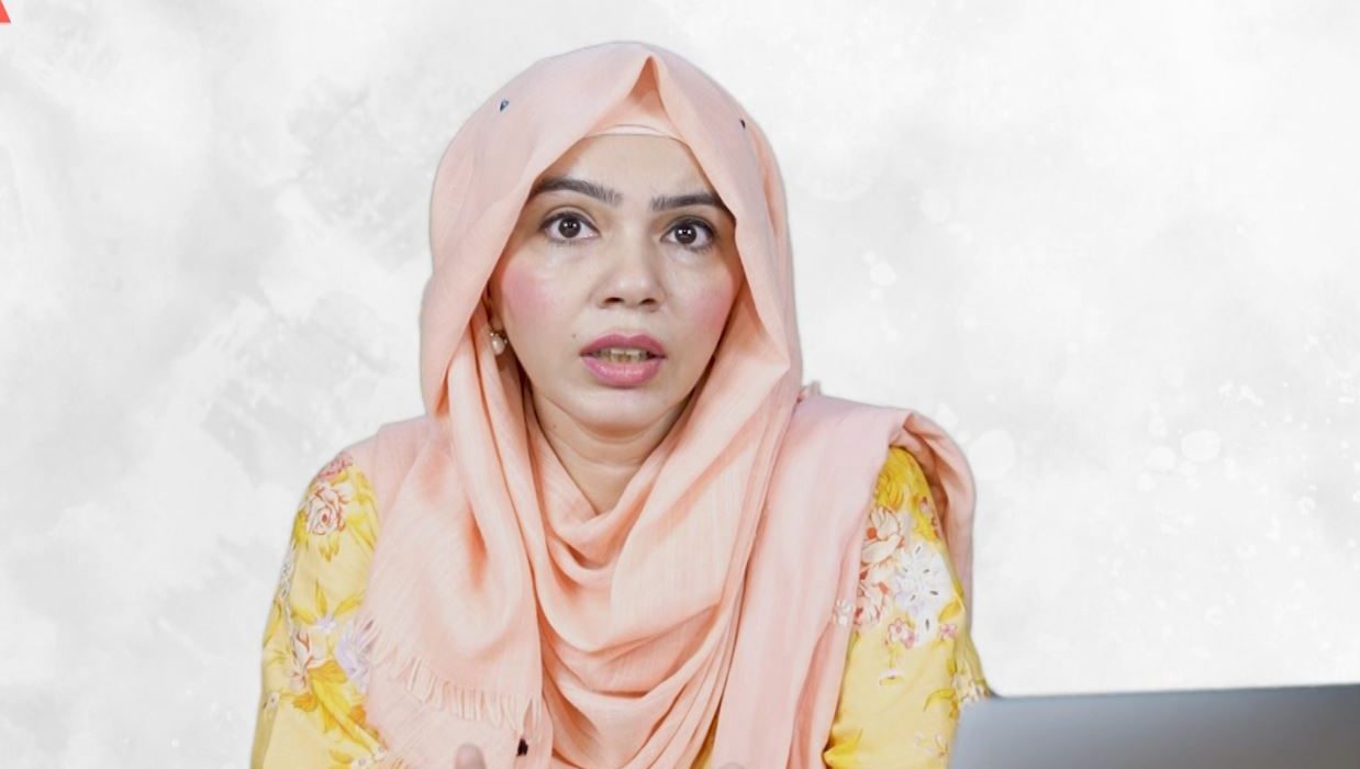 Female doctor discussing Safe contraception methods with diverse group of women in a medical office.