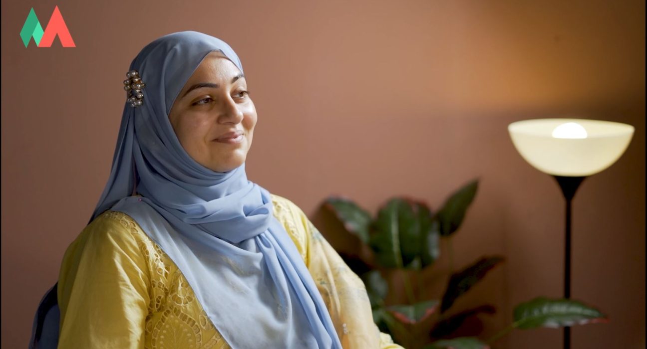 Group of people in a warm, cozy room, listening to each other with empathy and kindness, symbolizing support for mental health.