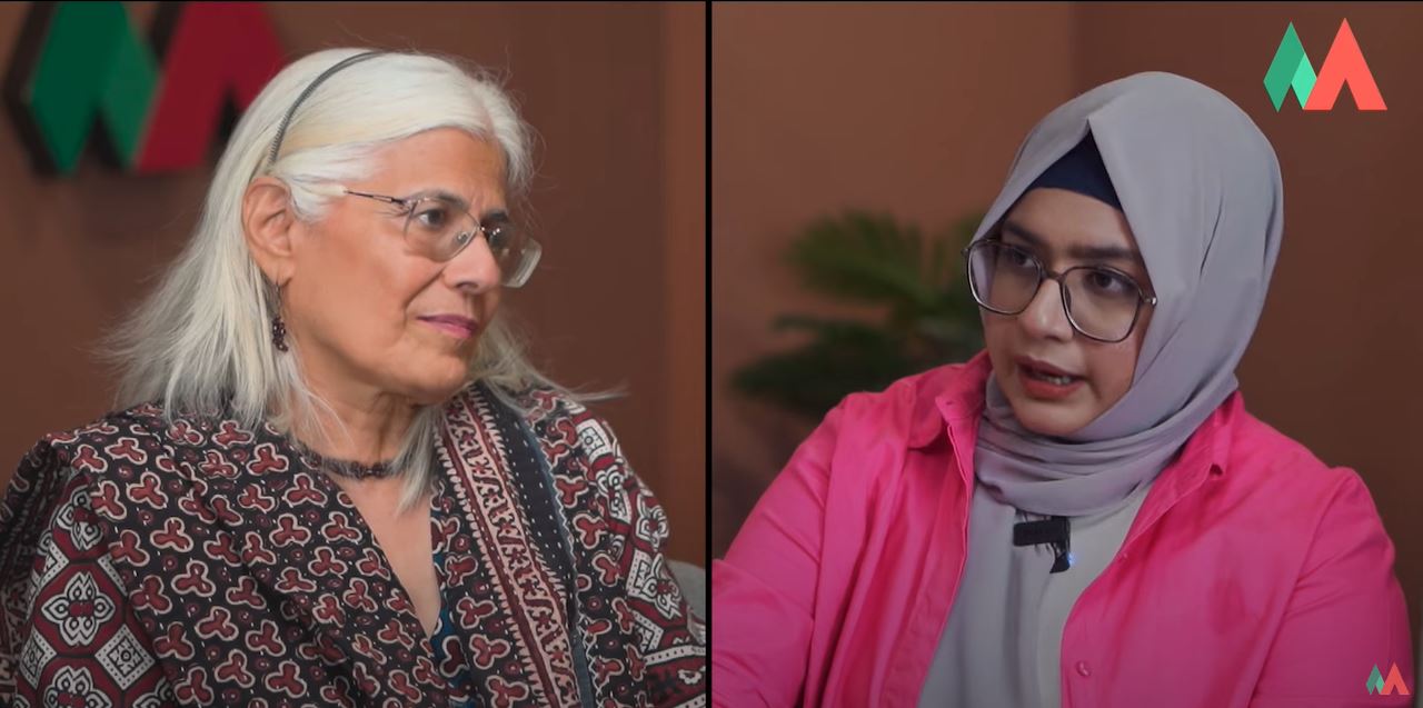 Aafia Salam, a breast cancer survivor, standing with supportive friends and family, symbolizing the strength of community in fighting breast cancer.